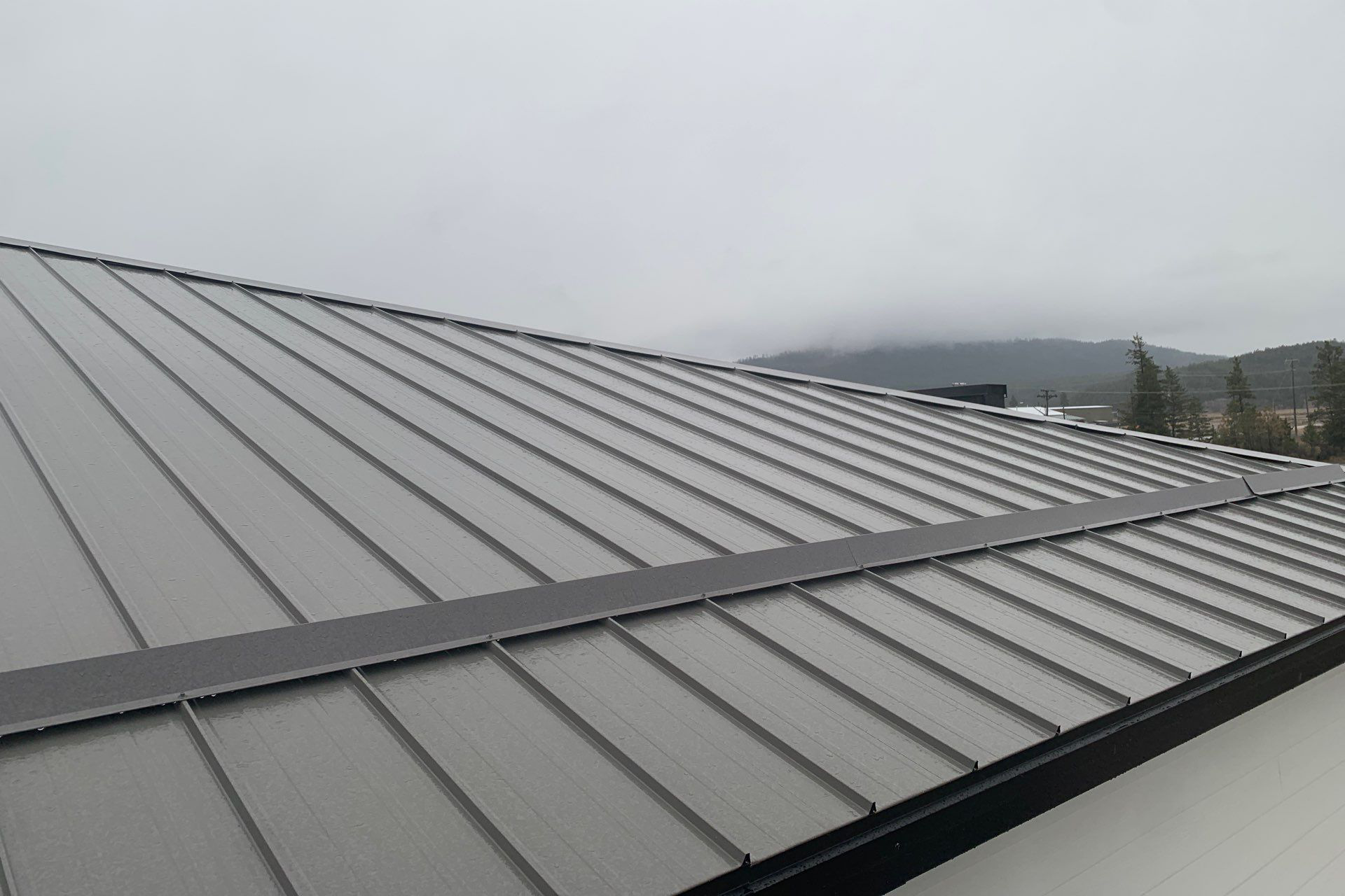 Standing seam roof panels formed on-site by LiWo Metals